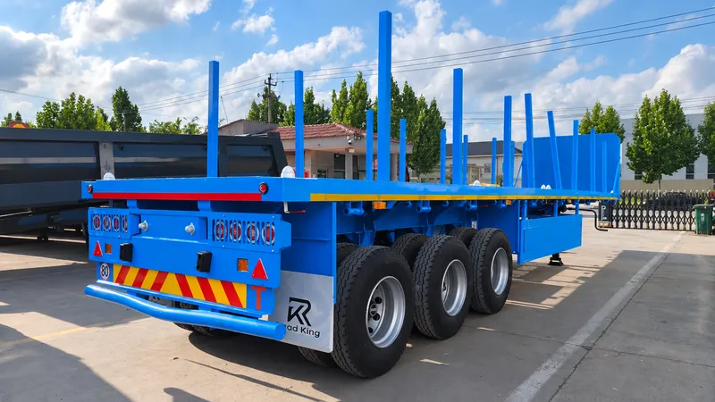 3 Axle Flatbed Semi Trailer with Removable Stakes for Cargo Transport